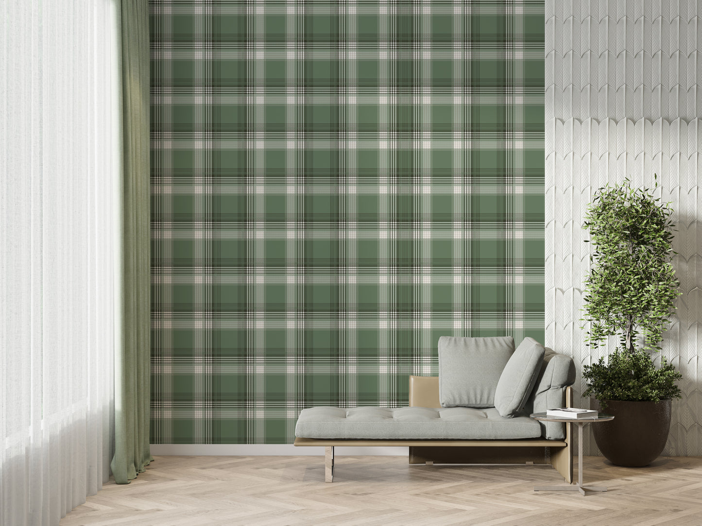 A modern living space featuring a prominent olive green and white plaid wallpaper accent wall. In front of the wall sits a sleek grey chaise lounge with matching plush pillows, accompanied by a small, round metal side table. To the left, a large window is dressed with sheer white curtains and long, sage green drapes over herringbone wood flooring. To the right, a textured white feature wall provides contrast, with a large potted green plant in a dark ceramic planter standing in the corner.