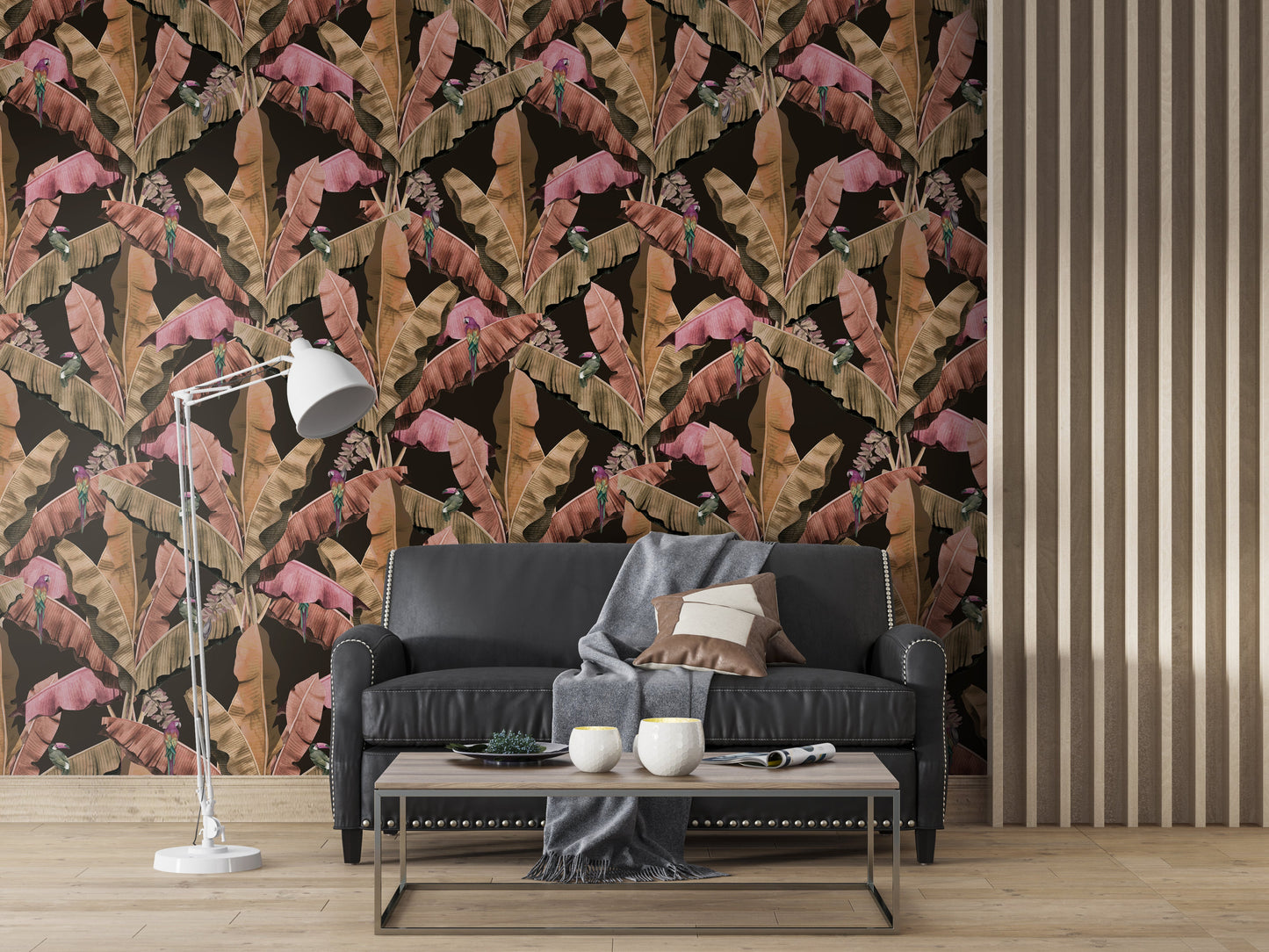 An architectural perspective of a contemporary lounge featuring the Banana Leaves Pattern as a full-scale feature wall. The wallpaper’s deep brunette and wood-toned hues pair strikingly with a tan leather sectional, brass lighting, and minimalist decor, creating a sophisticated and cozy tropical atmosphere.