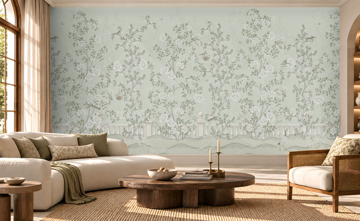 Elegant living room featuring Florentine Bloom sage green floral wallpaper with white roses and botanical vines, complemented by a cream sofa, natural wooden furniture, and soft daylight.