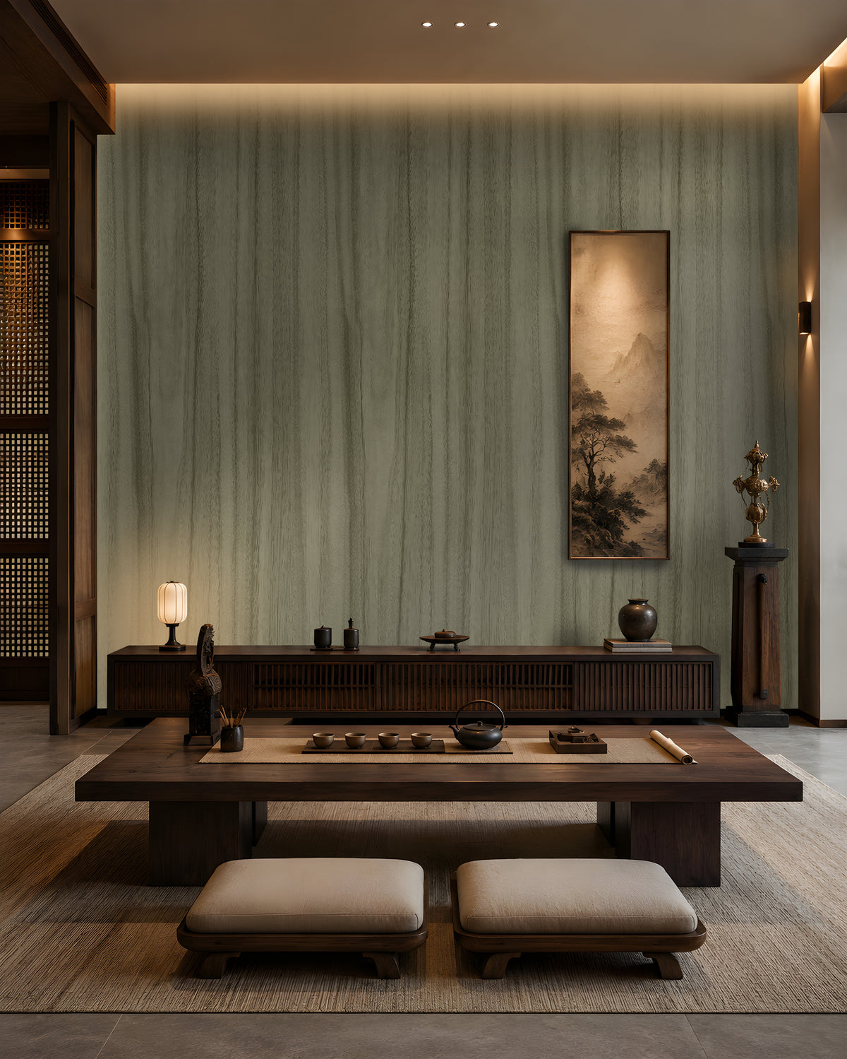 Wood Seamless Wallpaper - Moss Green displayed in a sophisticated Japandi-inspired living space. The wallpaper features a muted moss green tone with subtle vertical wood grain textures, creating a seamless natural look. Paired with dark wooden furniture, soft ambient lighting, neutral floor cushions, and elegant décor accents, the wallpaper adds depth, warmth, and a calming organic aesthetic to the interior.