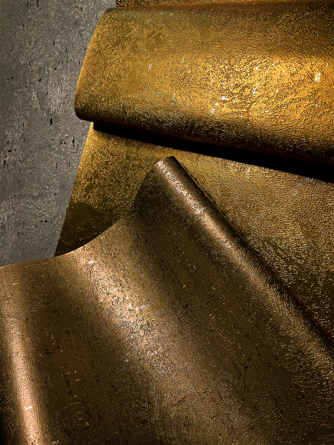 metallic wallcovering rolls displayed in beautiful light