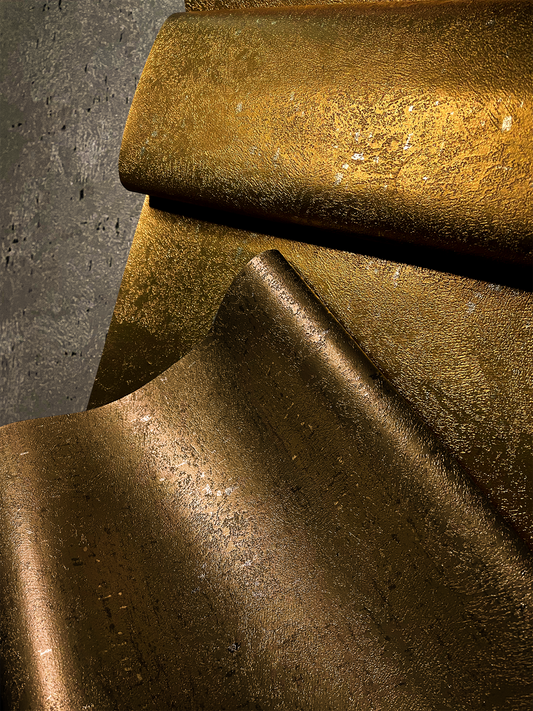 metallic wallcovering rolls displayed in beautiful light