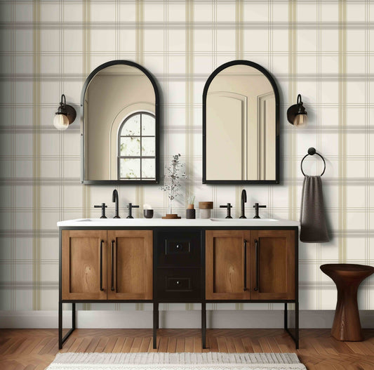 A neutral interior space features a classic plaid wallpaper in ivory and taupe tones.
The textured design displays a detailed grid pattern with intersecting beige, brown, and cream lines.
In front, a minimalist light-colored wooden wishbone chair with a woven seat is centered.
The simple setting is subtly completed by a small round side table holding a dark grey vase.