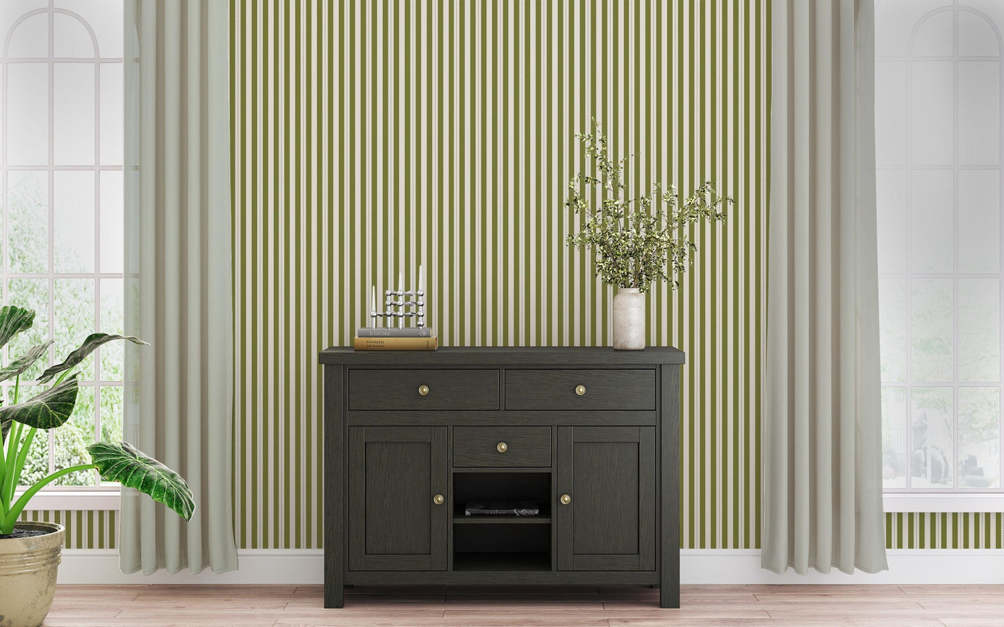 A bright dining area features a soft moss green and white striped wallpaper.
The clean design shows vertical green lines repeating across a textured white base.
In front, a warm wooden table is set with minimalist black chairs.
The sophisticated setup is completed by a contemporary black pendant light hanging above.