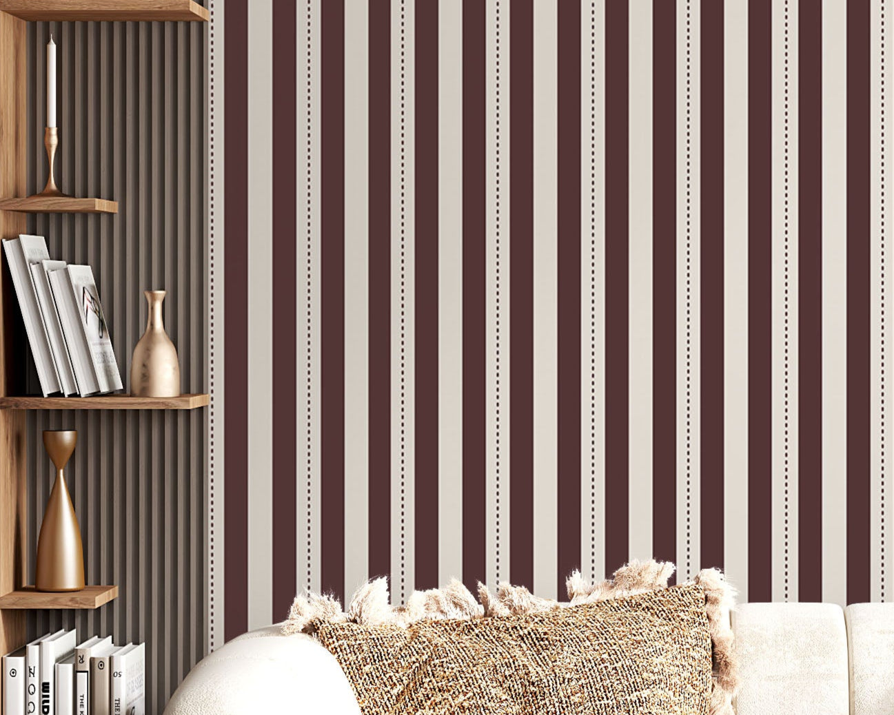 A creative workspace features a bold dark mahogany brown and beige striped wallpaper.
The detailed design shows clean vertical brown bands alongside beige stripes with thin dotted lines.
In front, a light wood desk table is neatly arranged with books, office supplies, and a clock.
The structured setup is grounded with a modern black stool and storage organizers.