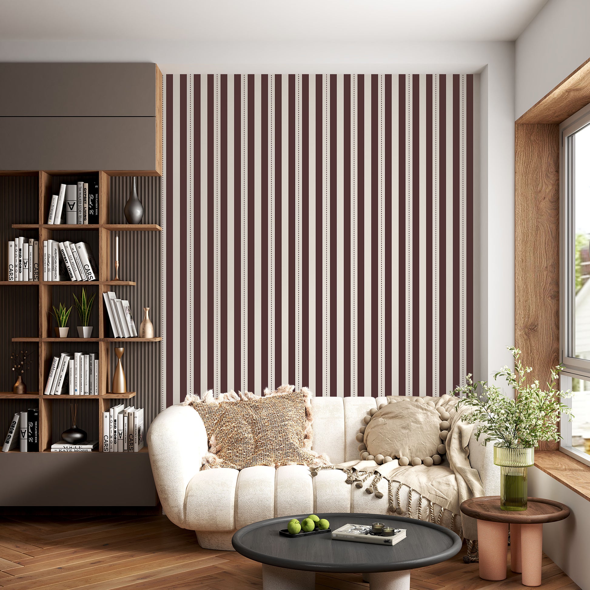 A creative workspace features a bold dark mahogany brown and beige striped wallpaper.
The detailed design shows clean vertical brown bands alongside beige stripes with thin dotted lines.
In front, a light wood desk table is neatly arranged with books, office supplies, and a clock.
The structured setup is grounded with a modern black stool and storage organizers.