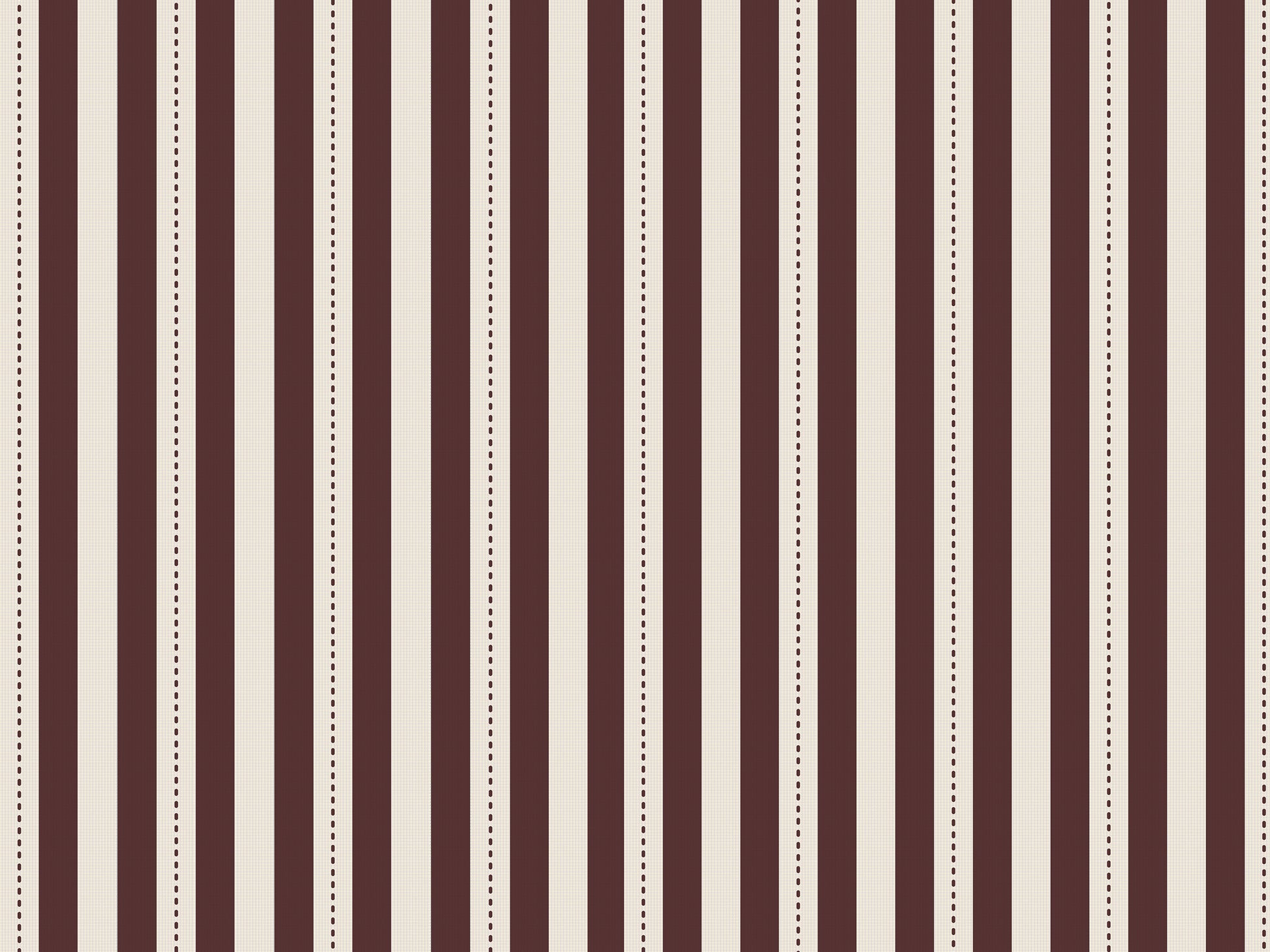 A creative workspace features a bold dark mahogany brown and beige striped wallpaper.
The detailed design shows clean vertical brown bands alongside beige stripes with thin dotted lines.
In front, a light wood desk table is neatly arranged with books, office supplies, and a clock.
The structured setup is grounded with a modern black stool and storage organizers.