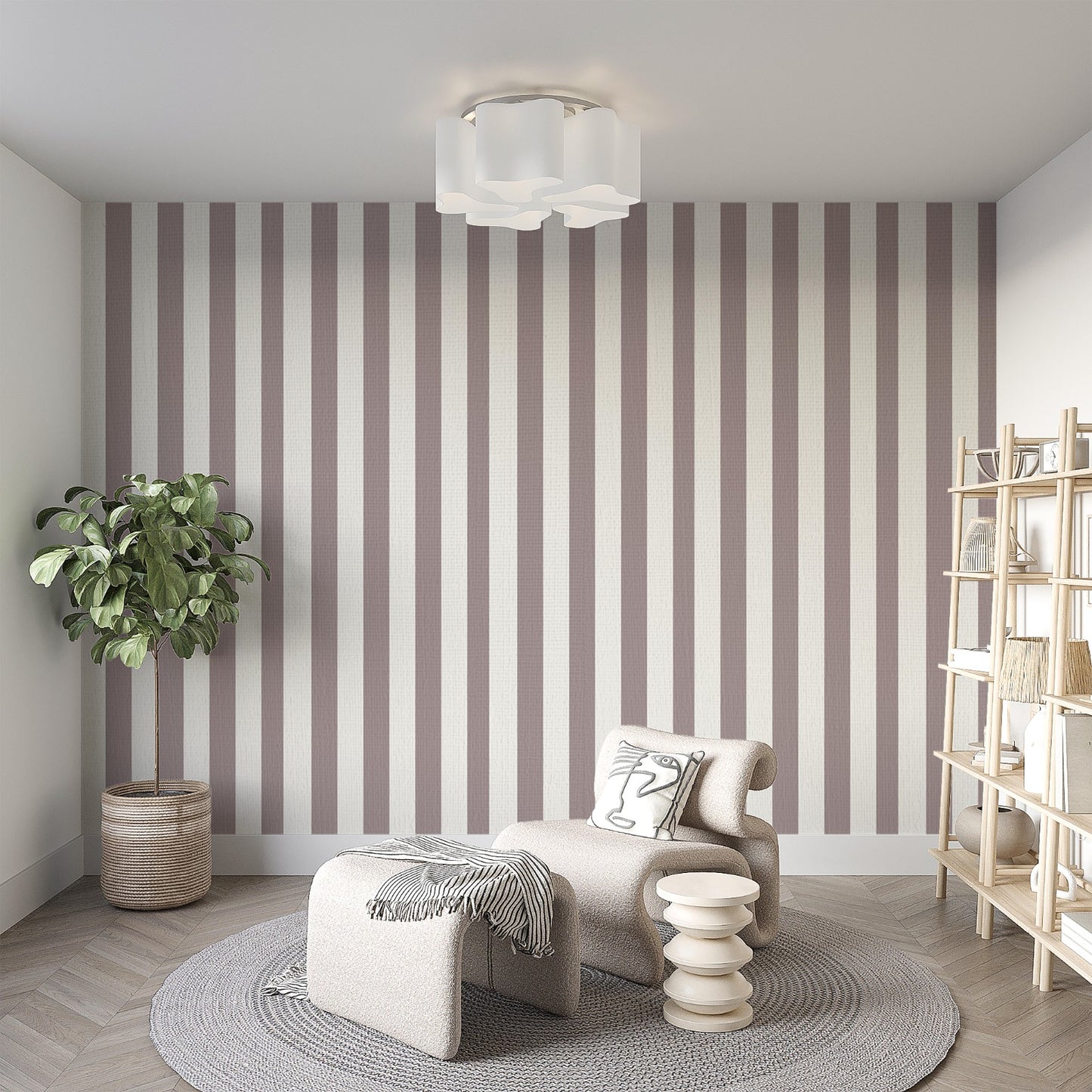 A modern living room features a muted taupe and off-white striped wallpaper.
The design showcases clean, evenly spaced vertical lines covering the main back wall.
In front, a stylish cream-colored lounge chair and matching ottoman sit on a round rug.
The minimalist space is complete with a large potted plant and a light wood bookshelf.