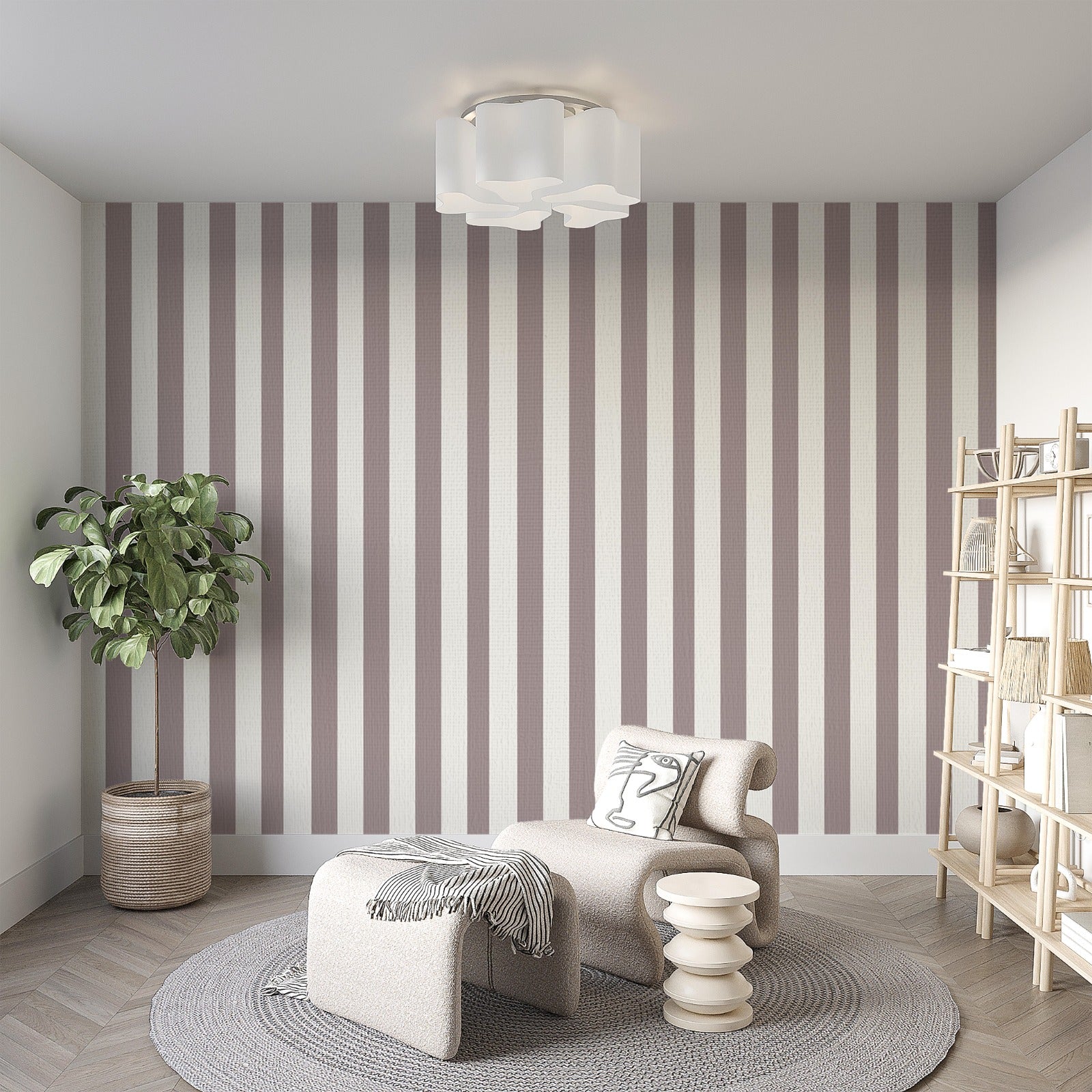 A modern living room features a muted taupe and off-white striped wallpaper.
The design showcases clean, evenly spaced vertical lines covering the main back wall.
In front, a stylish cream-colored lounge chair and matching ottoman sit on a round rug.
The minimalist space is complete with a large potted plant and a light wood bookshelf.
