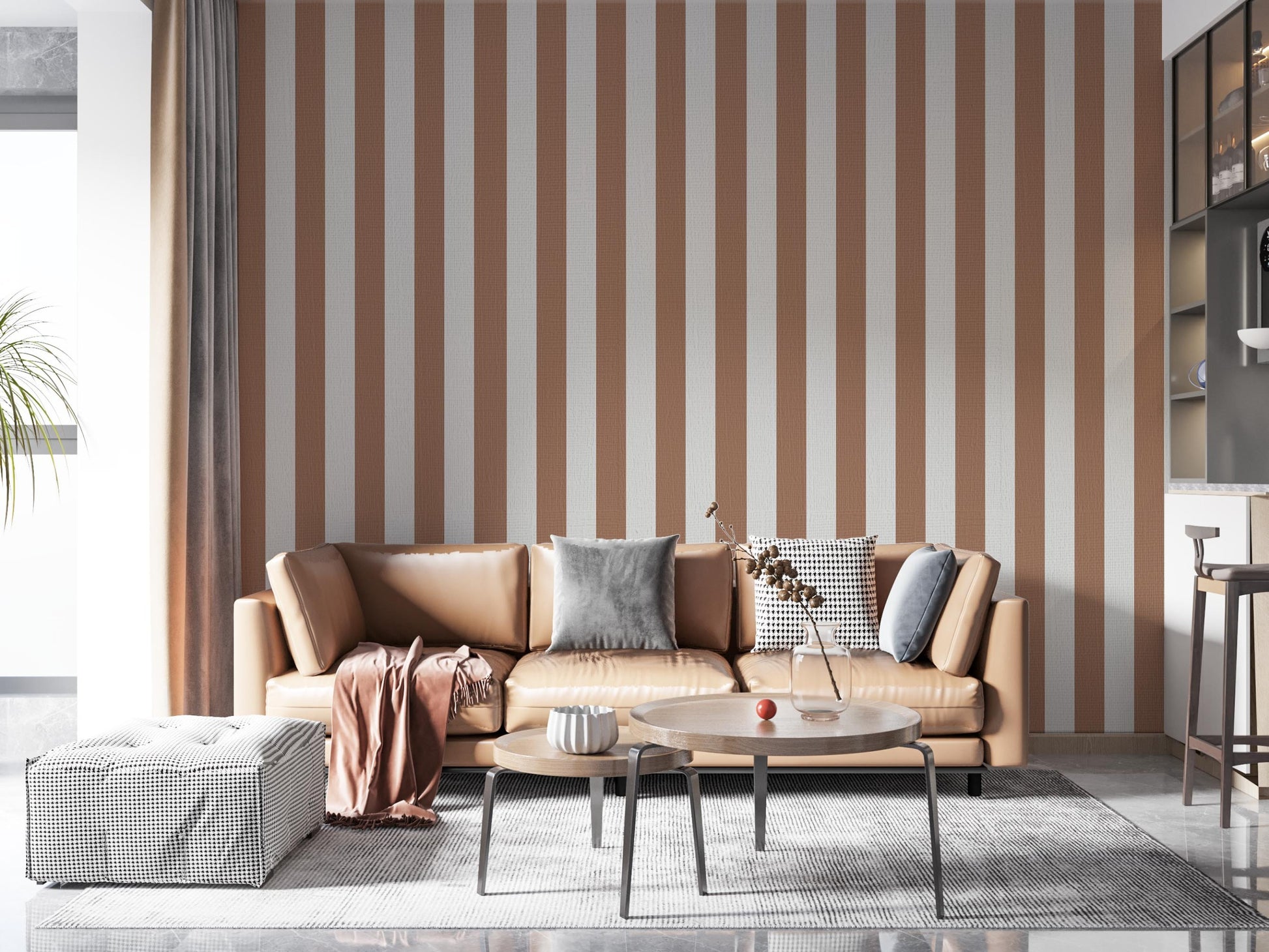 A modern living room features a warm cocoa brown and off-white striped wallpaper.
The design showcases clean, evenly spaced vertical stripes filling the central wall.
In front, a tan leather sofa with decorative pillows frames a round coffee table setup.
The stylish space is complete with a large area rug and an accent bar stool on the right.