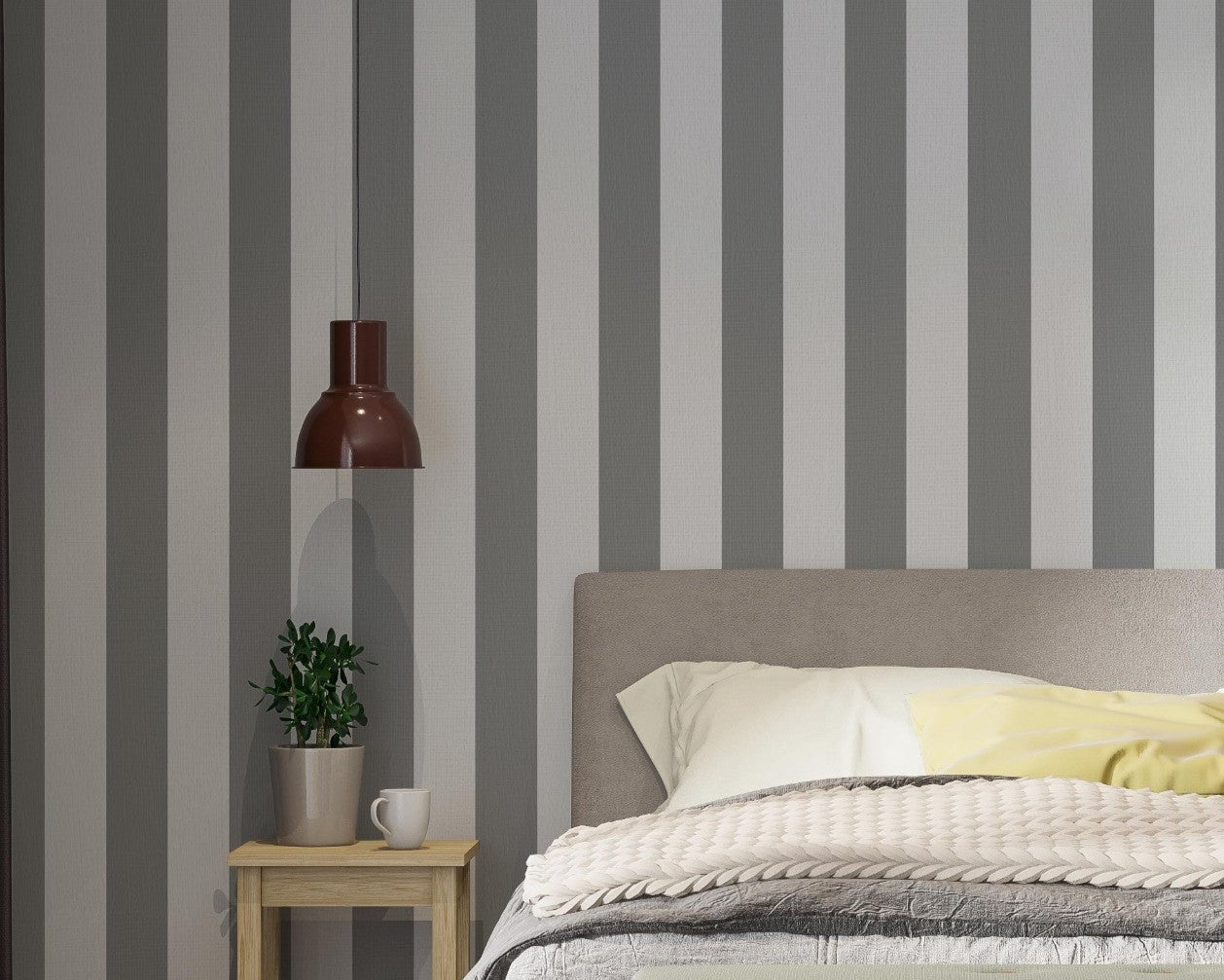 A modern bedroom features a simple grey and white striped wallpaper.
The design showcases clean, evenly spaced vertical stripes filling the main wall.
In front, a fully dressed bed with a fabric headboard centers the cozy setup.
The styled space is finished with a wooden bench, a side table, and a green plant.
