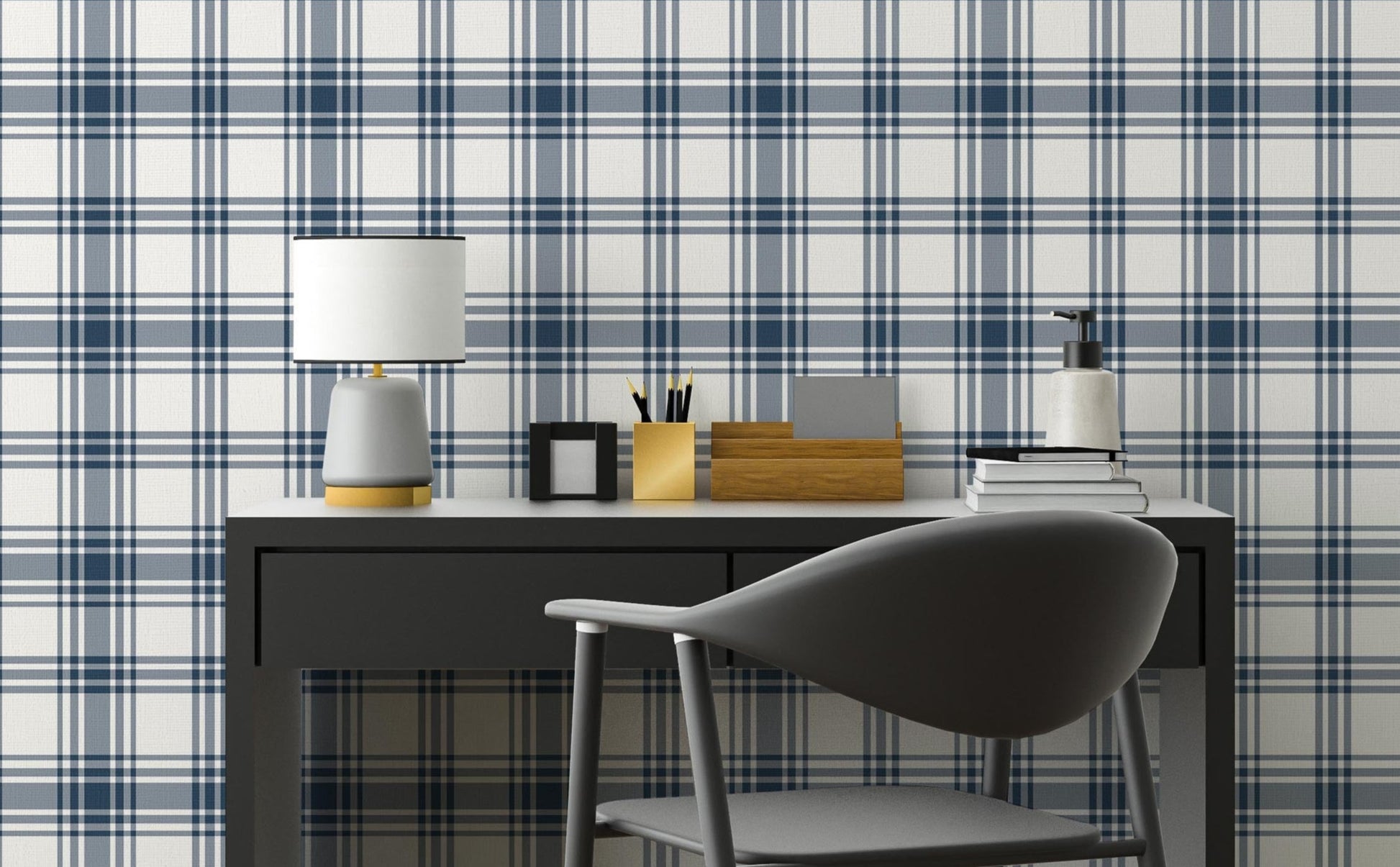A clean workspace setup features a classic navy blue and white plaid wallpaper.
The detailed design shows intersecting dark blue stripes forming grids on a white base.
In front, a sleek dark grey desk holds a small lamp, notebooks, and office accessories.
A modern dark grey desk chair with a rounded back completes the organized study area.