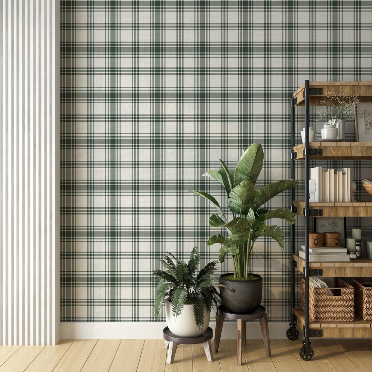 A modern room features a crisp white and forest green plaid wallpaper.
The detailed pattern shows intersecting dark green lines crossing over a light base.
In front, two vibrant green potted plants sit nicely on small stands.
A tall, industrial-style wooden shelving unit completes the organized corner setup.