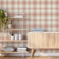Peach plaid wallpaper featuring a soft checkered pattern in warm peach and beige tones, styled in a modern Scandinavian-inspired room with wooden furniture, indoor plants, and minimal decor, creating a cozy and elegant interior backdrop.