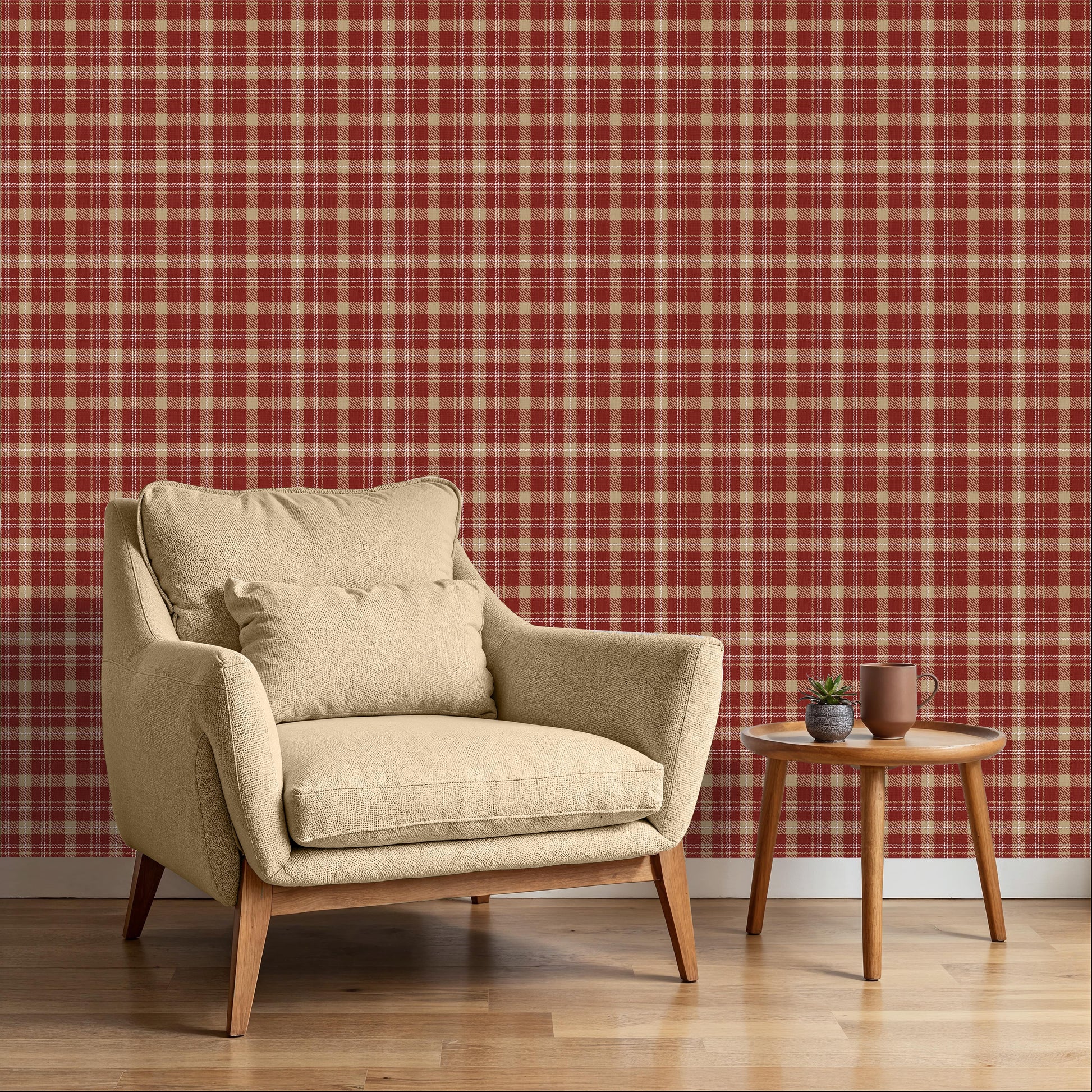 A close-up view displays wallpaper with a warm red background.
The design features a classic, tight plaid and tartan pattern.
It includes a mix of thick beige stripes that form large blocks.
Fine white lines crisscross over the grid, adding detailed accents.
The colors combine deep red, soft tan beige, and crisp white lines.
The overall pattern has a textured fabric appearance in a traditional style.