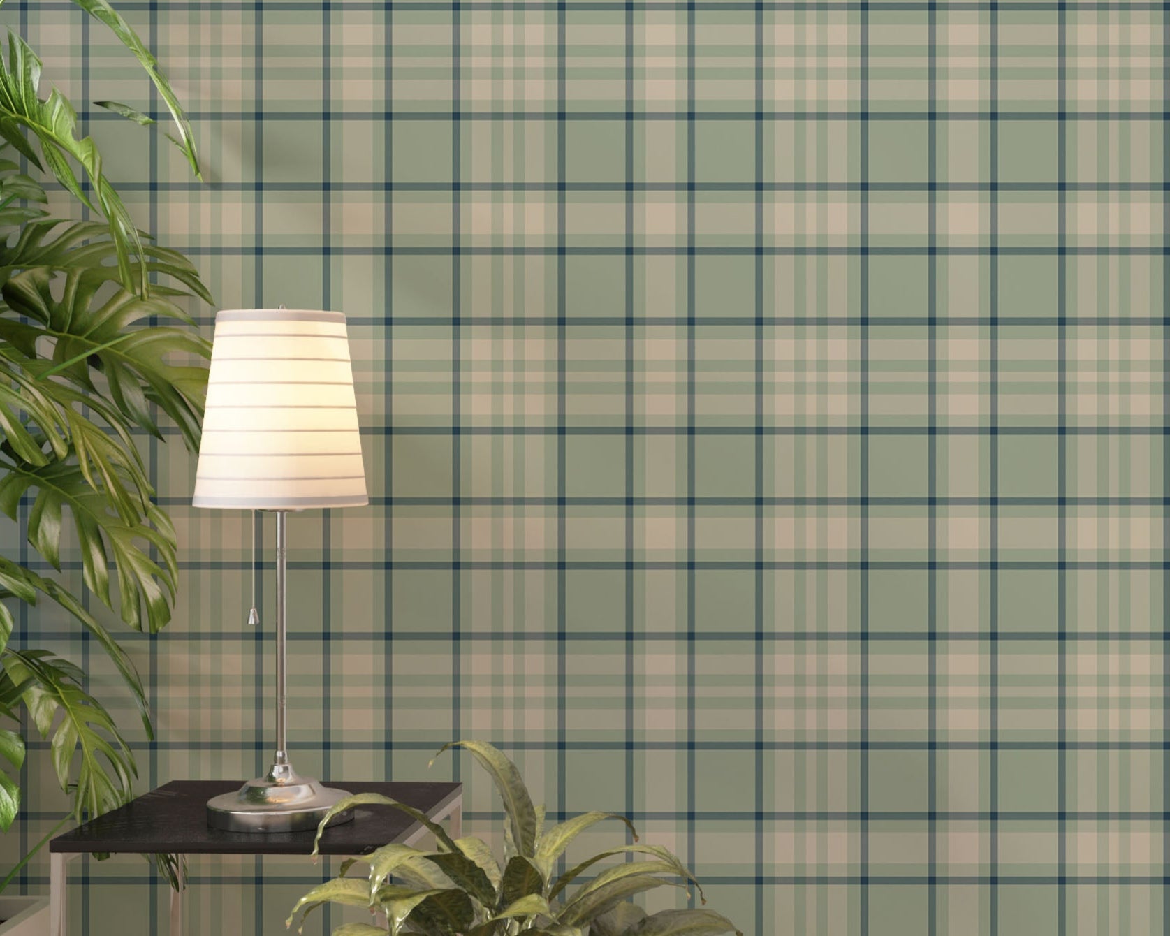 A light and airy living room featuring a vintage moss green, soft brown, and cream plaid wallpaper accent wall. In the foreground, a mid-century modern armchair with a pale mint-green cushion sits on a striped area rug. Behind the chair, a long light oak media console with open shelving displays books and potted succulents. To the right stands a matching small light oak bookshelf styled with white, beige, and black ceramic vases and a decorative white box.