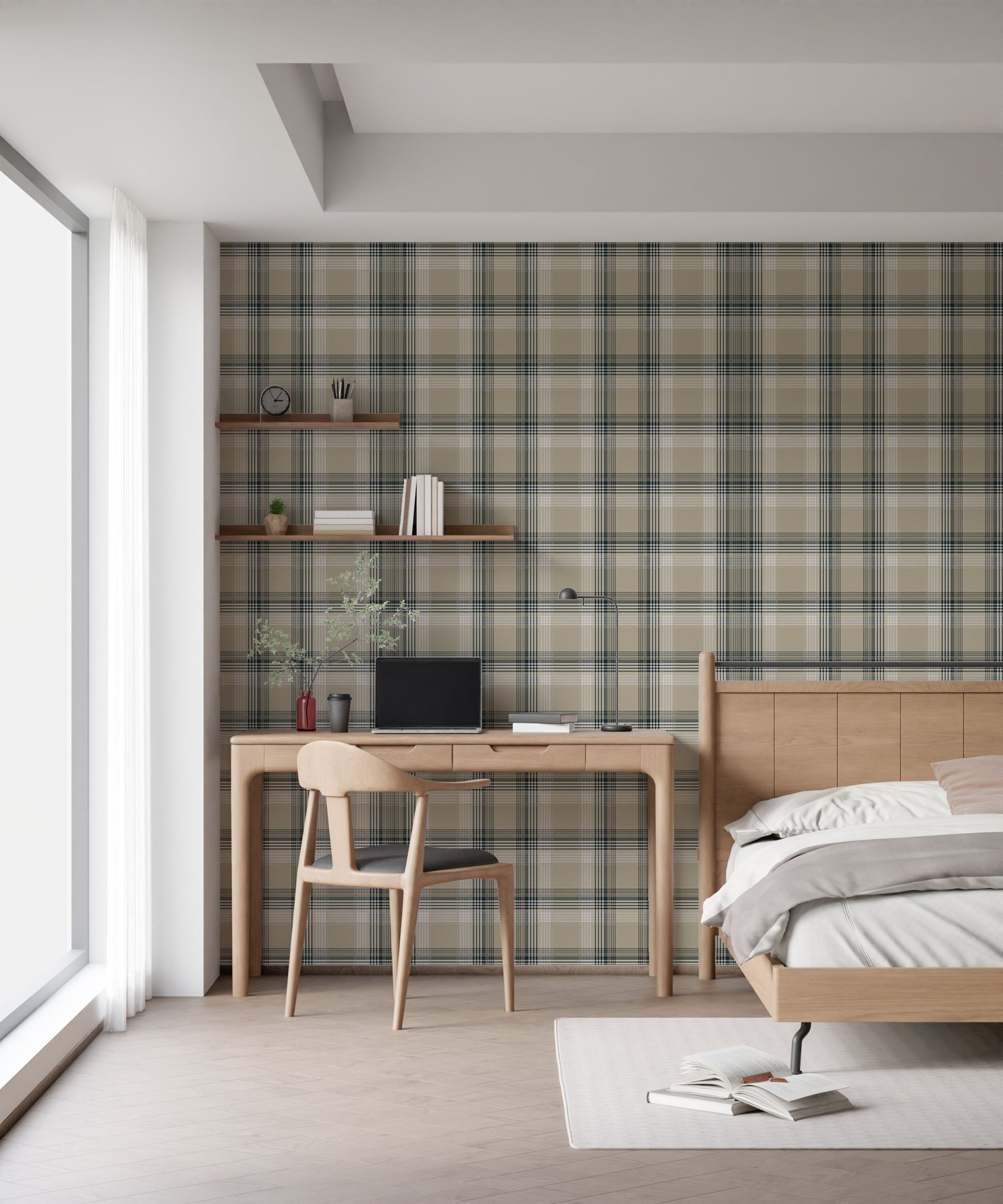A closeup of a modern bedroom and study area featuring a prominent stone-beige plaid wallpaper. On the left, a light oak wooden desk holds a closed laptop, a small stack of books, and a sleek, matte black metal desk lamp. To the right, a matching light oak wooden headboard and bedframe are visible, with a crisp white duvet pillow and a soft beige accent pillow resting on top.