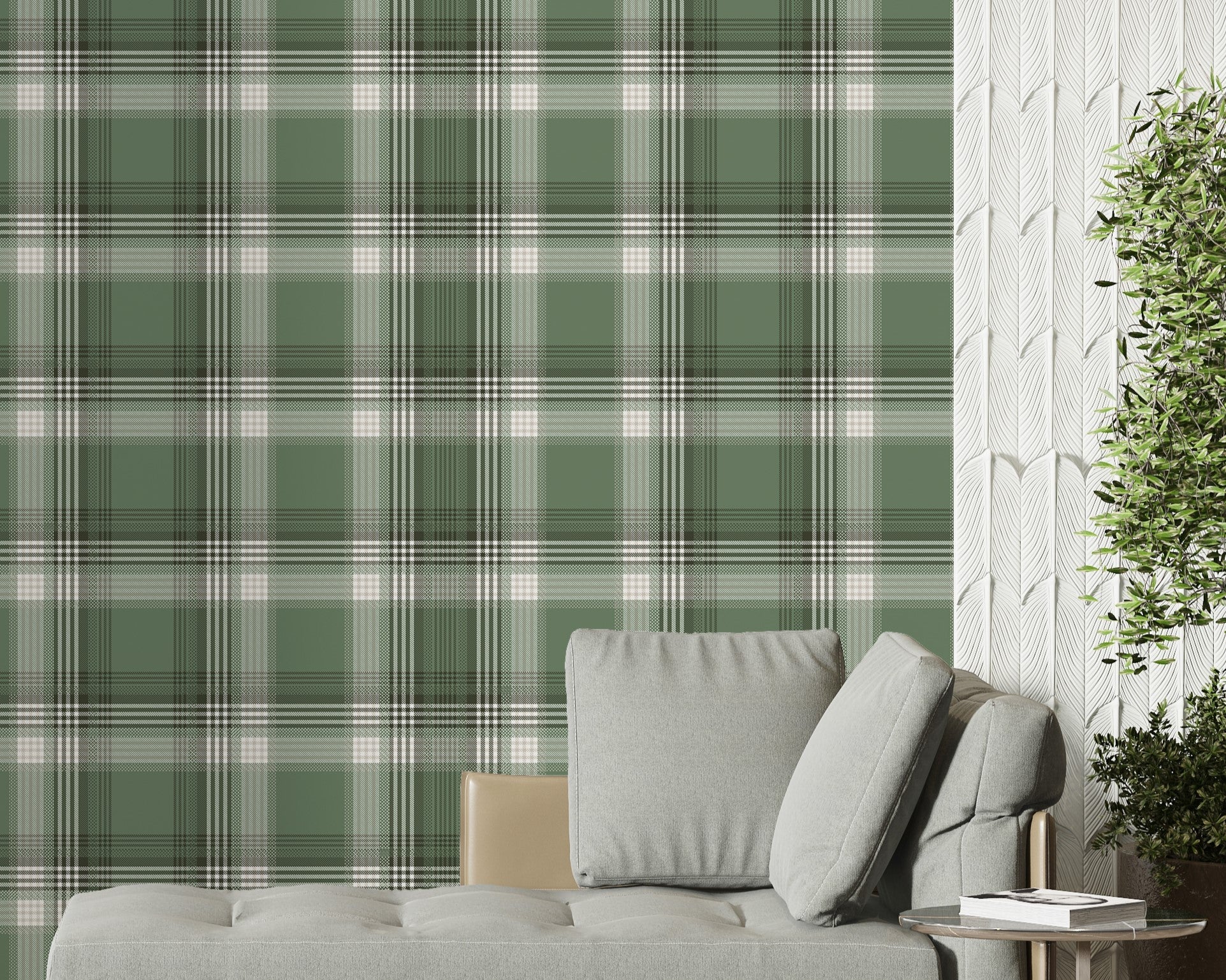 A modern living space featuring a prominent olive green and white plaid wallpaper accent wall. In front of the wall sits a sleek grey chaise lounge with matching plush pillows, accompanied by a small, round metal side table. To the left, a large window is dressed with sheer white curtains and long, sage green drapes over herringbone wood flooring. To the right, a textured white feature wall provides contrast, with a large potted green plant in a dark ceramic planter standing in the corner.