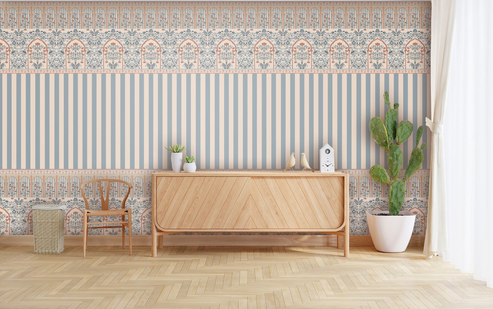 Rajmahal Floral Stripe Wallpaper and Blue Palace Wall  shown on a living room wall behind a wooden cabinet, chair, and cactus plant, as seen.