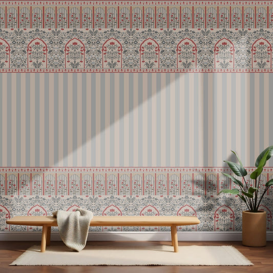 Rajmahal Floral Stripe Wallpaper and  Blue Grey Palace Wall styled in a room behind a light wood bench with a blanket and a potted plant, as seen.