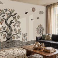Vanvaani Gond Forest mural wallpaper in beige and black featuring intricate Gond-inspired tree, birds, wildlife motifs, and flowing patterns on a living room feature wall.