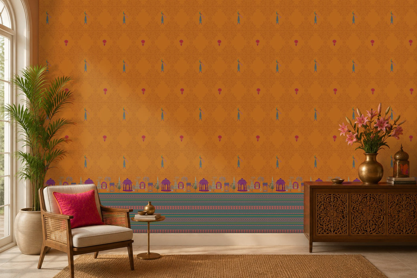 Royal Garden Heritage Wallpaper in Burnt Saffron with intricate peacock motifs, floral accents, and traditional Indian architectural border design, styled in a warm living room with wooden furniture, brass décor, and natural textures.