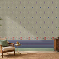 Royal Garden Heritage Wallpaper in Pistachio Green featuring intricate floral motifs, elegant peacock-inspired details, and decorative Mughal garden architecture borders in royal blue and rani pink, styled in a bright living room with cane furniture, carved wooden cabinetry, indoor plants, and natural woven textures.