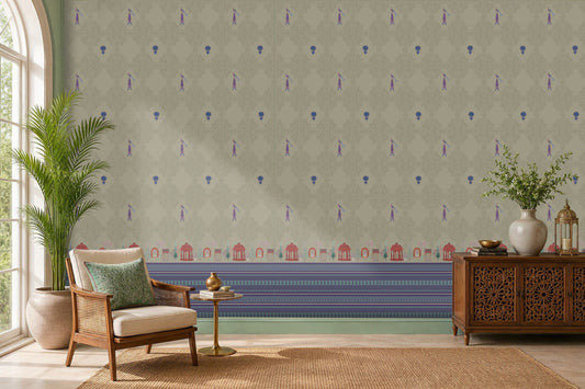 Royal Garden Heritage Wallpaper in Pistachio Green featuring intricate floral motifs, elegant peacock-inspired details, and decorative Mughal garden architecture borders in royal blue and rani pink, styled in a bright living room with cane furniture, carved wooden cabinetry, indoor plants, and natural woven textures.
