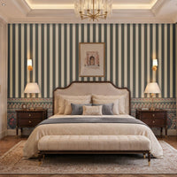 Elegant bedroom featuring 1371_DA Rajmahal Heritage Stripe Wallpaper in slate grey with classic vertical stripes, decorative heritage border, upholstered bed, wooden nightstands, and warm luxury interior décor.