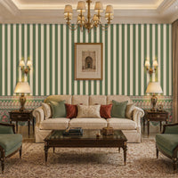 Elegant traditional living room featuring heritage-inspired green and cream striped wallpaper with decorative floral border, classic beige sofa, vintage wooden coffee table, green accent armchairs, warm brass lighting, and sophisticated timeless décor.