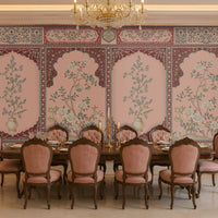 Persian Floral Panels wallpaper in Ivory Red & Pink featuring elegant arched botanical panels, delicate floral artwork, and intricate Persian-inspired borders in soft ivory, blush pink, and deep burgundy tones, showcased in a luxurious classic dining room with ornate wooden furniture and traditional décor.