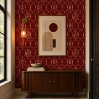 Modern entryway featuring rich burgundy wallpaper with an elegant Mughal-inspired trellis pattern, styled with a mid-century wooden console, abstract framed artwork, brass wall sconce, and warm contemporary décor for a sophisticated luxury interior.