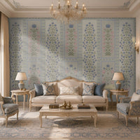 Luxury living room featuring the 1411_DA Imperial Floral Panel – Blue Blossom wallpaper with elegant blue floral panel motifs, soft botanical detailing, ornate borders, and a refined classic interior accented by ivory furniture and crystal chandelier.