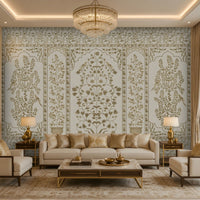 Elegant living room featuring a luxurious ivory and gold Gulmohar floral wallpaper with Mughal-inspired botanical panels and delicate bird motifs, creating a timeless Indian heritage interior with classic furniture, warm lighting, and sophisticated décor.