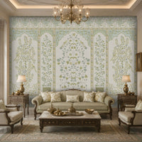 Elegant living room showcasing a sage green and ivory Gulmohar floral wallpaper with Mughal-inspired botanical panels, delicate bird motifs, and heritage detailing. The sophisticated wallpaper complements classic upholstered furniture, ornate wooden accents, warm lighting, and luxurious Indian-inspired interiors.