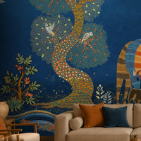 Traditional Gond Art wallpaper in royal blue featuring hand-painted Indian folk art with trees, birds, wildlife, and village life, displayed as a luxury living room feature wall.