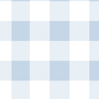 A charming room features a soft pastel checks wallpaper in a frosted blue theme.
The delicate design displays a clean grid pattern with intersecting blue and cream lines.
In front, a small wooden table holds a white vase with small pink flowers.
The sweet, bright interior space creates a calm, simple, and comforting atmosphere.