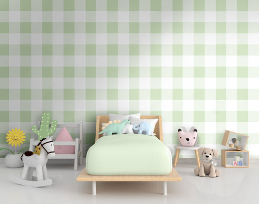 A bright nursery room features a soft gingham check wallpaper in celadon green.
The delicate design displays a large grid pattern with alternating pastel yellow and white blocks.
In front, a white wooden baby crib filled with illustrated animal cushions is centered.
The playful interior space is nicely completed by a tiny white chair holding a soft toy.