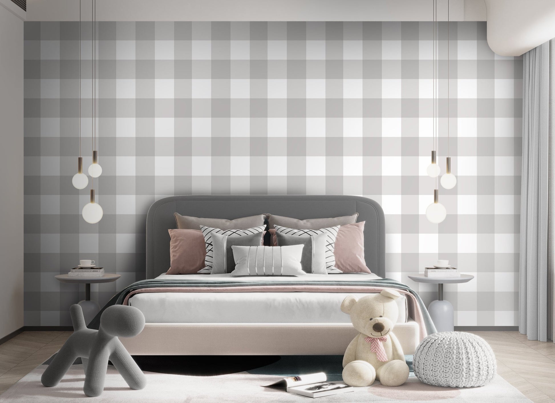 A serene nursery room features a soft gingham check wallpaper in cloud grey.
The design displays a large grid pattern with alternating light grey and white blocks.
In front, a white wooden baby crib filled with plush star and animal toys is centered.
The calm and peaceful interior layout is nicely completed by a light grey rug on the floor.