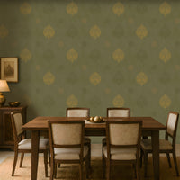 An architectural perspective of a lounge featuring the Vintage Damask Wallpaper in Deep Olive. The large-scale damask pattern creates a warm, storied atmosphere, perfectly complementing natural wood textures and leather furniture for a refined, global-inspired interior.
