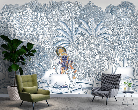A wide-angle interior view featuring the Krishna Pichwai Wallpaper as a large-scale feature wall. The Yale Blue mural transforms the room into a tranquil, gallery-like space, harmonizing perfectly with modern furniture and natural greenery to create a sophisticated cultural focal point.