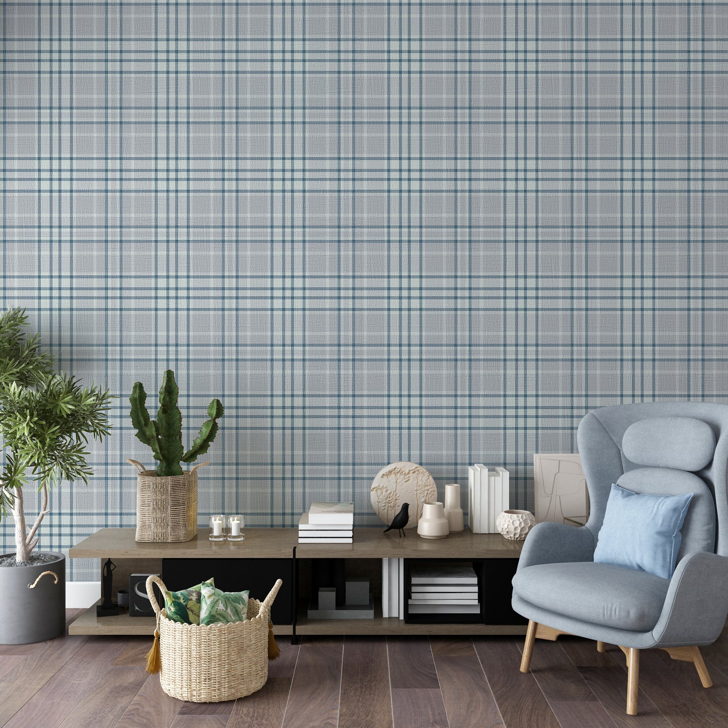 A modern living room features a textured plaid wallpaper in soft lavender grey tones.
The fabric-look pattern displays an intricate grid with intersecting blue-grey and white lines.
In front, a comfortable light blue wingback chair with a matching pillow sits to the right.
The cozy interior space is completed by a low wooden console table holding books and decor.