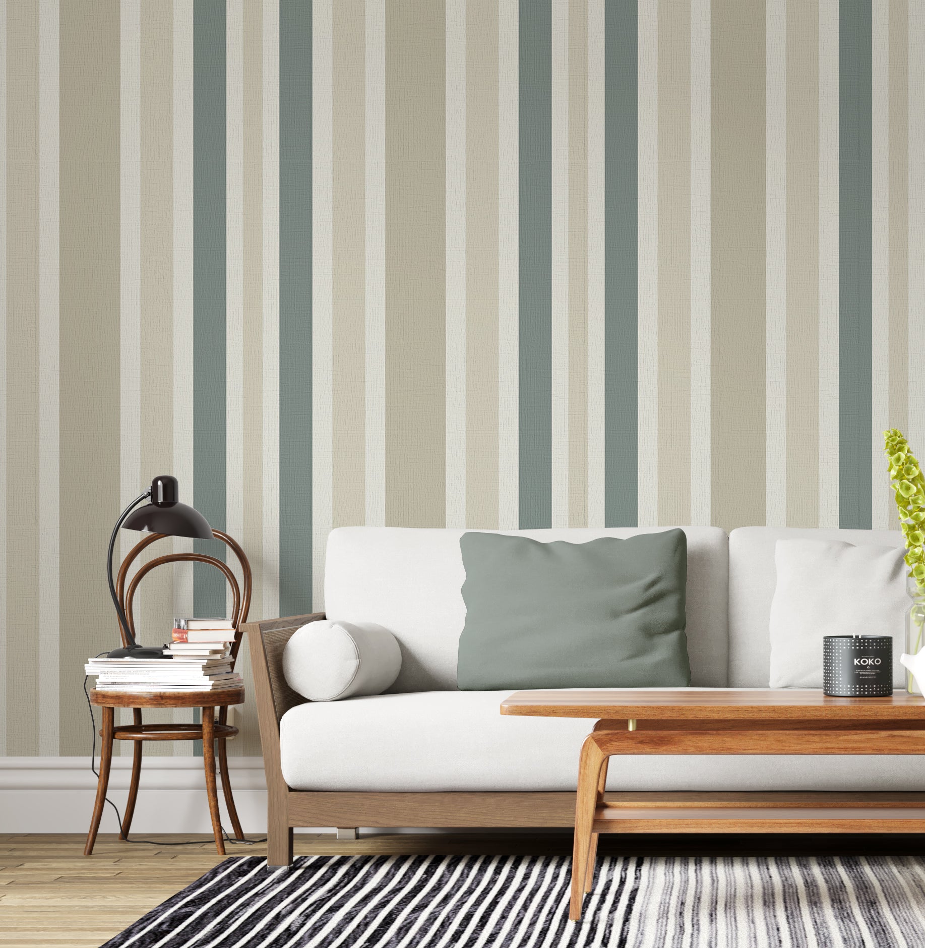 A minimal living room features a textured striped wallpaper in a whisper sand theme.
The fabric-textured design shows clean vertical lines in muted sage green, beige, and cream.
In front, a comfortable white sofa with grey throw pillows is centered in the space.
The calm interior setup is beautifully completed by a leafy green potted plant on the right.