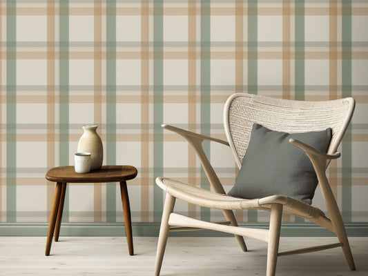 A calm, modern interior space features a classic plaid wallpaper in cream and beige tones.
The detailed fabric-look design displays a structured grid pattern with intersecting tan and sage green lines.
In front, an elegant light wood lounge chair with a dark grey pillow is placed to the right.
The simple minimalist room setting is completed by a small three-legged wooden side table on the left.