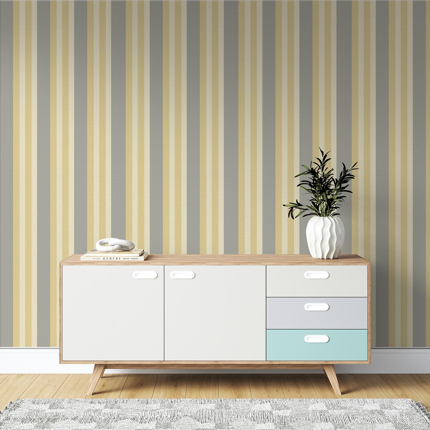 A contemporary room setup features a bold midnight timber wallpaper with vertical stripes.
The textured design displays alternating dark charcoal, brown, and grey vertical bands across the wall.
In front, a rustic wooden desk is paired with a matching wooden chair and a fabric armchair.
The sophisticated interior space is complete with a sleek black desk lamp and an open view window.
