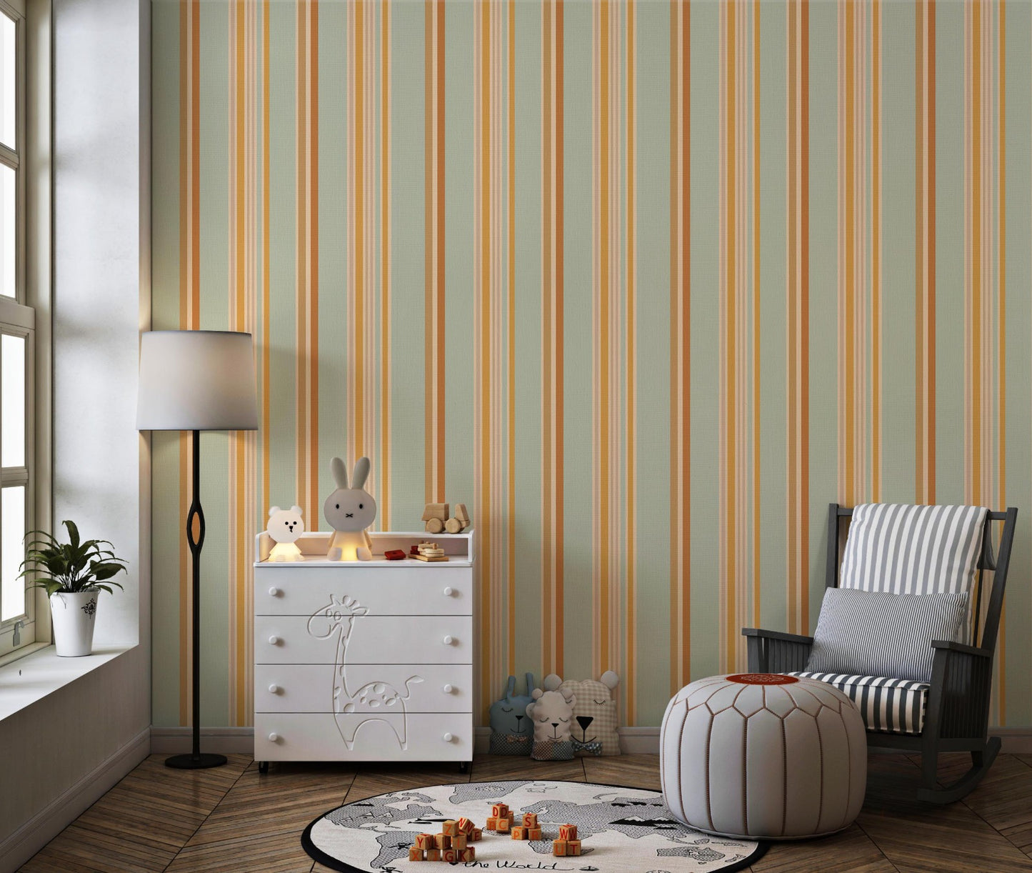 A child's playroom features a muted olive green wallpaper with warm colored stripes.
The detailed pattern shows vertical bands of orange, yellow, and cream running down the wall.
In front, a white giraffe-themed dresser stands next to a dark rocking chair and pouf.
The playful space is neatly arranged with children's toys and a round world map rug.
