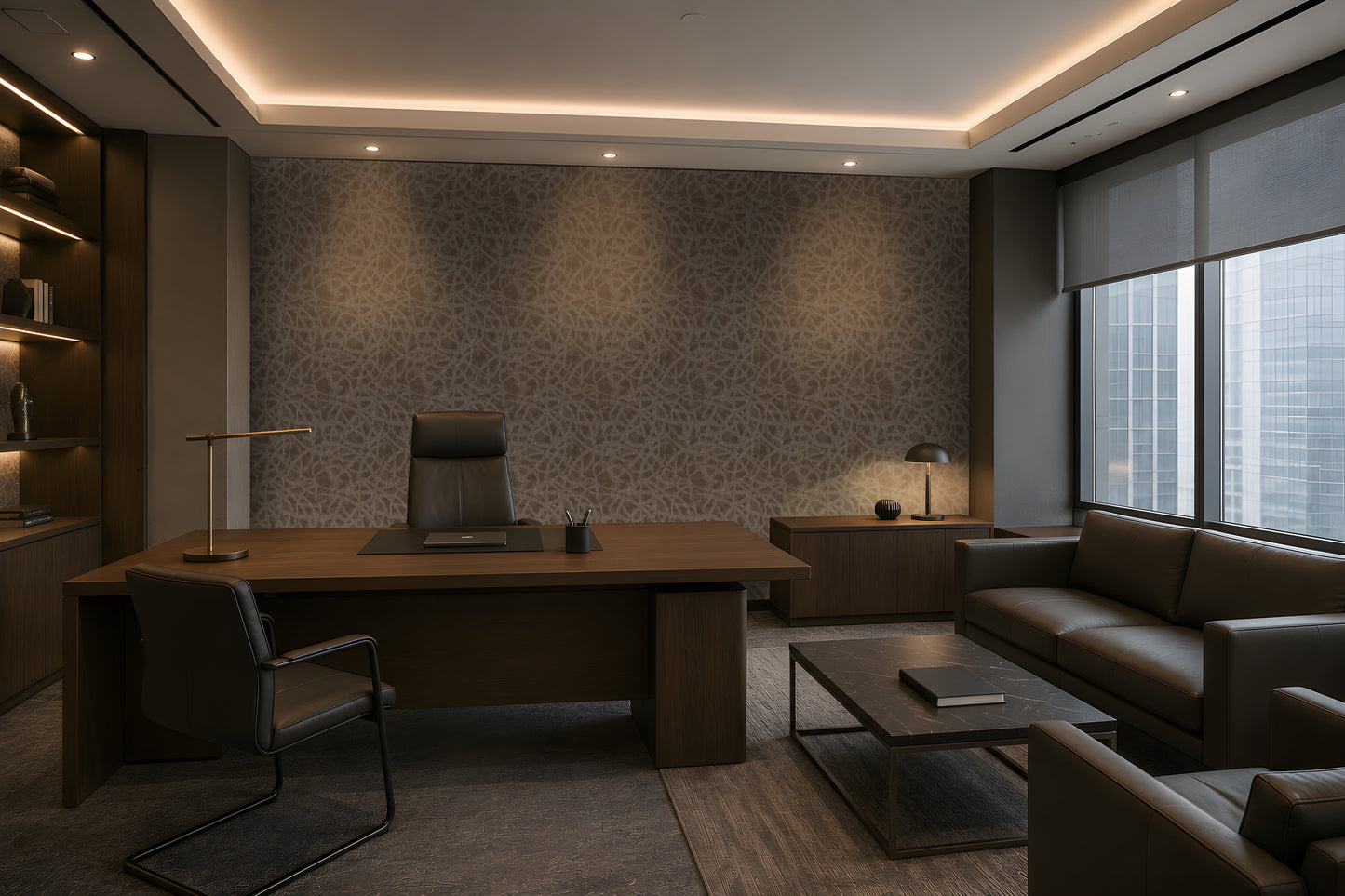A sophisticated executive office with a warm, contemporary aesthetic: a large walnut desk, dark leather seating, integrated wood cabinetry, a textured taupe-gray feature wall, concealed warm LED lighting, recessed ceiling illumination, floor-to-ceiling windows with roller shades, and a refined lounge area with a leather sofa and marble coffee table. The palette is restrained and architectural, combining dark wood, charcoal, warm gray, and brass accents.
