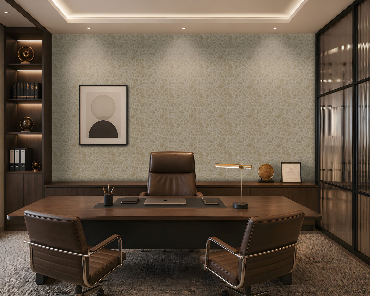 A sophisticated executive office with a symmetrical, formal composition. A large walnut desk faces two brown leather guest chairs, with a high-back executive chair behind it. The room features a pale beige textured feature wall with an organic abstract pattern, dark walnut built-in cabinetry and shelving, warm integrated LED lighting, minimalist abstract artwork, sculptural décor, and a bronze desk lamp. A ribbed translucent glass partition on the right adds architectural separation while allowing filtered 