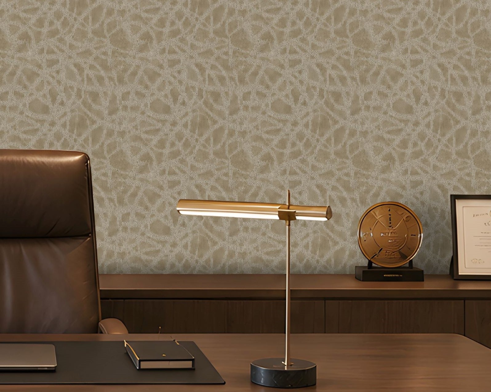 A sophisticated executive office with a symmetrical, formal composition. A large walnut desk faces two brown leather guest chairs, with a high-back executive chair behind it. The room features a pale beige textured feature wall with an organic abstract pattern, dark walnut built-in cabinetry and shelving, warm integrated LED lighting, minimalist abstract artwork, sculptural décor, and a bronze desk lamp. A ribbed translucent glass partition on the right adds architectural separation while allowing filtered 