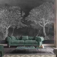 An architectural perspective of a sophisticated study featuring the Aranyam Mural in Grayish Green as a full-scale feature wall. The mural’s muted, illustrative vista pairs elegantly with light wood flooring and stone textures, creating a peaceful and cultured interior sanctuary.